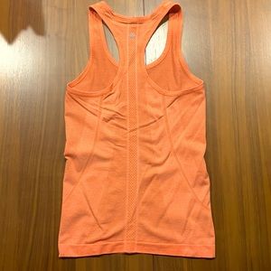 Orange lululemon swiftly racer back tank size 4